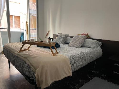 A bed or beds in a room at Bellavista-Bilocale-Loano