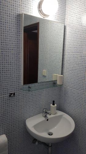 a bathroom with a sink and a mirror at Villa Moras in Paralia Katerinis