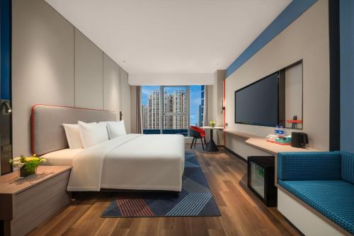Postel nebo postele na pokoji v ubytování Holiday Inn Express Nanjing Jiangbei Wonhall Mall