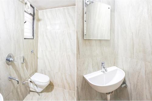 a white bathroom with a sink and a toilet at FabHotel Saffron Inn I - Nr Darshan Museum in Pune