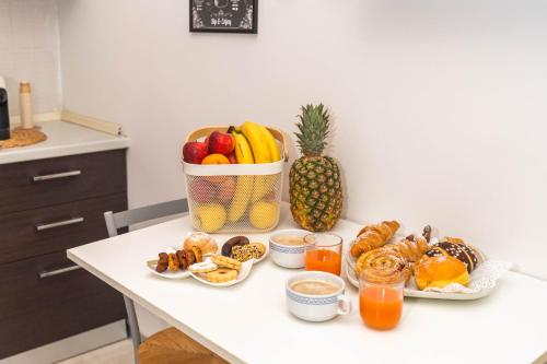 a table with a bunch of food and a pineapple at Casa GIO' GIO' Borgo San Basilio in Marina di Pisticci