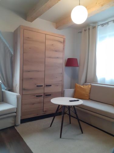 a living room with a couch and a table at Walkowy Dwor in Zakopane