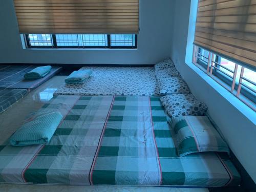 Tempat tidur dalam kamar di 502 Sân Bay Điện Biên