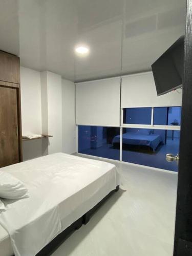 Apartaestudio de una habitación central tesisinde bir odada yatak veya yataklar