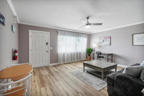 a living room with a couch and a table at Shoreline Serenity 3bd Dog Friendly Bckyrd in Satellite Beach