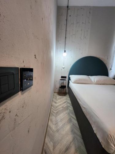Postel nebo postele na pokoji v ubytování Hotel Amfiteatar
