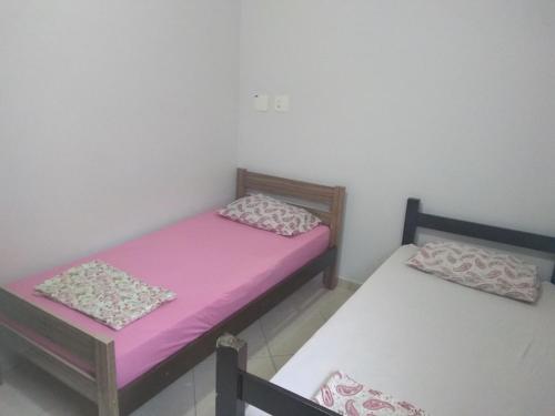 Giường trong phòng chung tại Lá em Casa Hostel