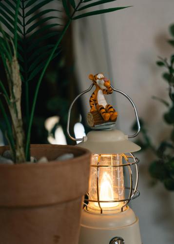 a lamp with a toy tiger on top of it at We are now here in Busan