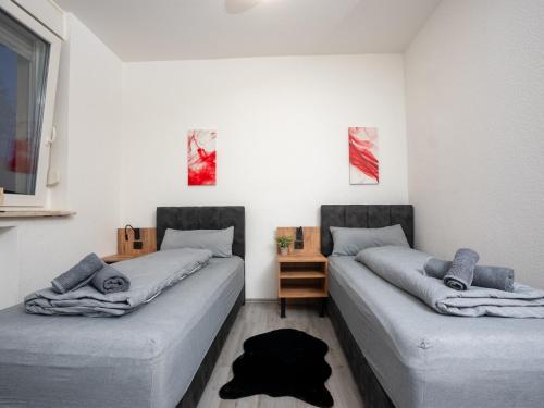 Katil atau katil-katil dalam bilik di Serviceroom24 - Apartment 3 in Recklinghausen WLAN - Smart-TV - 24-7 Check-in und Küche