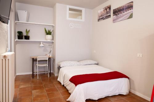 En eller flere senge i et værelse på bilocale centro storico Cesena
