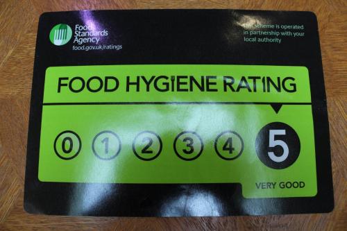 a food hygiene rating sign on a box of food hygiene ratings at Westleigh House in Fishbourne