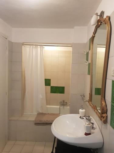 a bathroom with a sink and a shower and a tub at B&B La finestra sul bosco in Serralunga di Crea