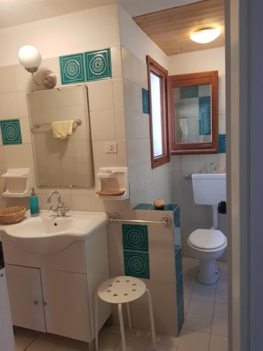 a bathroom with a sink and a toilet at B&B La finestra sul bosco in Serralunga di Crea