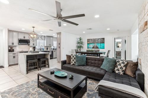 a living room with a couch and a table at Miami Oasis, Spacious 4-Bedroom Home with Pool in Miami