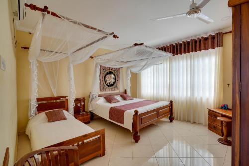 Ένα ή περισσότερα κρεβάτια σε δωμάτιο στο Villa Mandalay by Scenery Villas