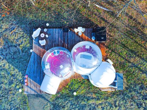 an overhead view of an object on a wooden table at L ost in Sensations -Hébergements Insolites et Suites de luxe Spa Sauna Piscine Forêt in Marcenas