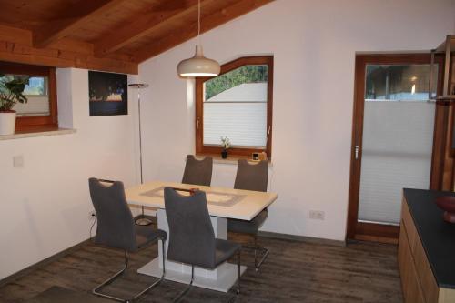 a dining room with a table and chairs at Fewo Waldheim in Greifenburg