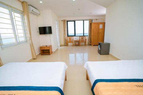 En eller flere senge i et værelse på Phú Hồng 3 Hotel