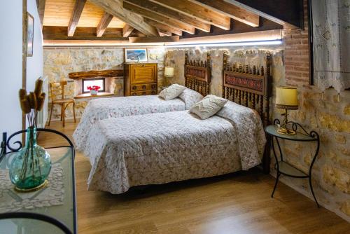 En eller flere senge i et værelse på El Rincón de Hornuez