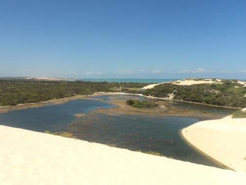a river on top of a sand dune at Pousada Aconchego de Genipabu in Jenipabu