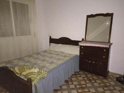 מיטה או מיטות בחדר ב-Dari