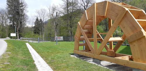 a wooden structure sitting on the side of a park at Penzion Mlyn - Bystra in Brezno
