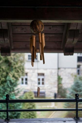 a chandelier is hanging from a porch at Villa Titina in Miedzygorze
