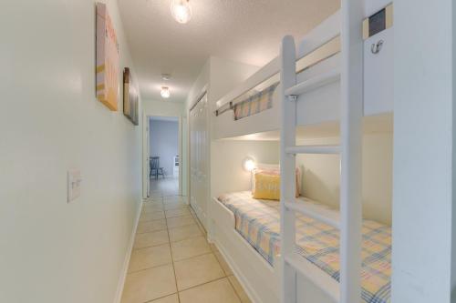 a hallway with two bunk beds in a room at Cozy PCB Condo Less Than half Mile to Public Beach Access! in Panama City Beach