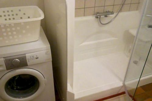 a bathroom with a washing machine and a washer at Appartement de 2 chambres avec jardin amenage et wifi a Rosureux in Rosureux