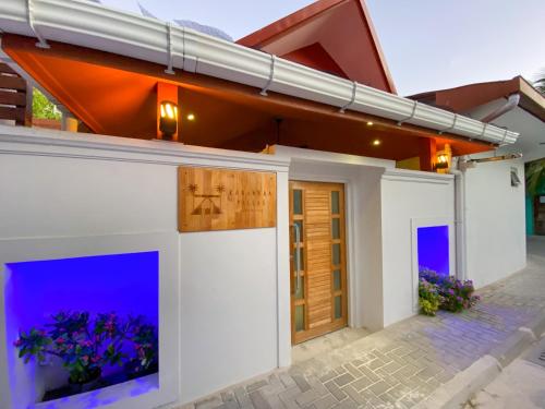 a house with an aquarium in the front yard at Karanka Villa @ Mahibadhoo in Mahibadhoo
