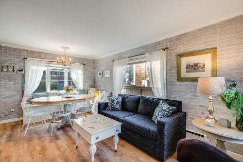 a living room with a couch and a table at Quaint Sur La Mer Cottage with Deck, Fire Pit in Seaside