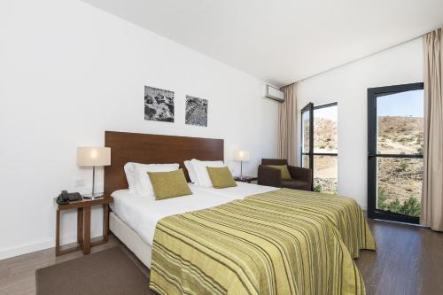 Ένα ή περισσότερα κρεβάτια σε δωμάτιο στο Hotel Museu