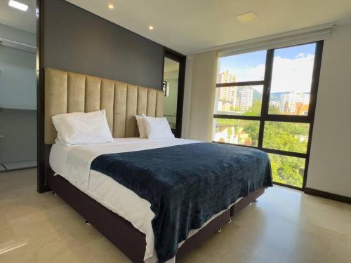 En eller flere senge i et værelse på 1201 Luxury Excelente ubicación