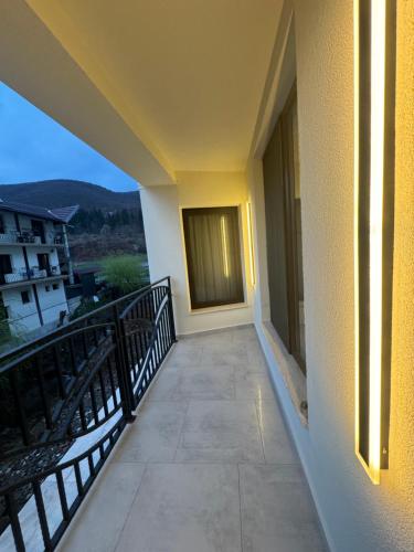 a balcony of a building with a view of a mountain at Conacul Peștera Urșilor in Chişcău