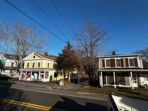 a street with two houses on a street at Walk To Goodspeed Opera House from this quaint 2 BDRM APT in East Haddam