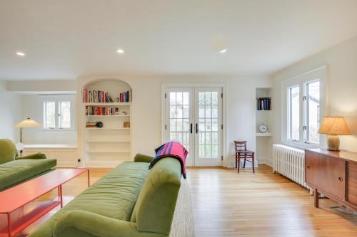 a living room with a couch and a table at Charming Greenwich Escape Near Wooded Trails! in Cos Cob