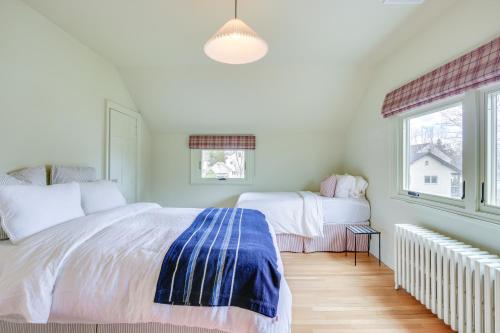 a bedroom with two beds and a window at Charming Greenwich Escape Near Wooded Trails! in Cos Cob