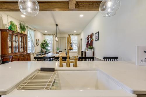 a kitchen and living room with a large white island at Hot Tub and Lake Access at Poconos Getaway! in Lake Ariel