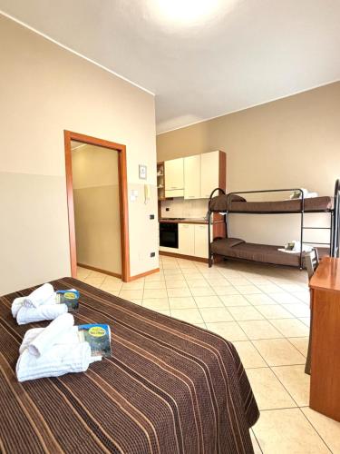 a hotel room with a bed and bunk beds at Residence Oasi Di Monza in Monza