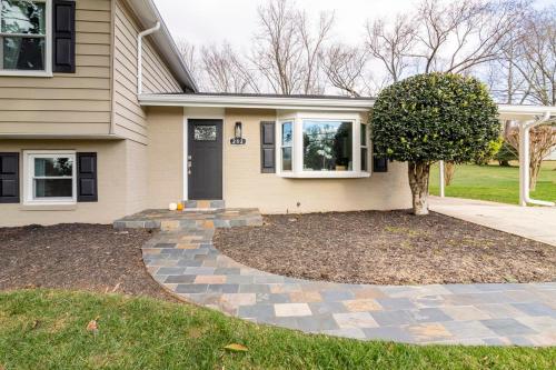 a house with a tree in the front yard at 5 bedrooms with 4 Full Bath Fire Pit BBQ and Plush Amen on 1 2 acre in Silver Spring