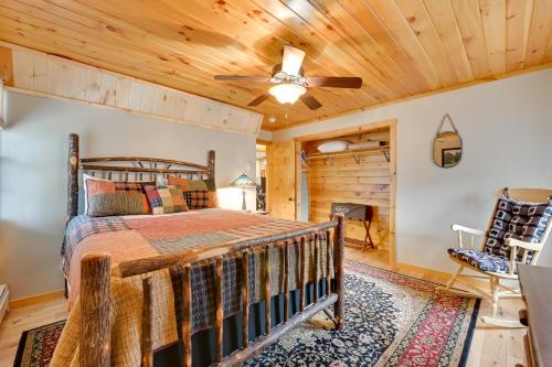 a bedroom with a bed and a ceiling fan at Lake George Vacation Rental - Walk to the Water! in Lake George