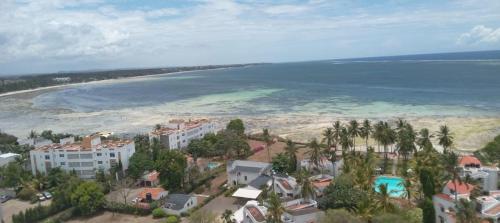 an aerial view of a beach and the ocean at Marina Beach Front homes in Mombasa