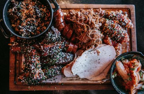 a plate of food with meat and other foods at Cave Hotel & Golf Resort in Faversham