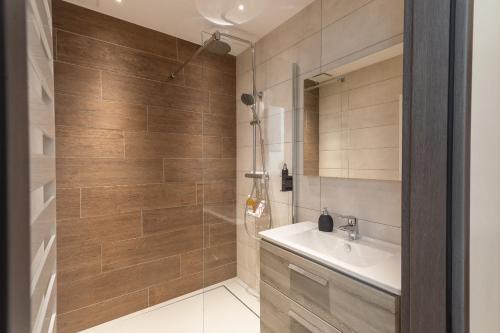 a bathroom with a sink and a shower at Eden'Roc in Labaroche