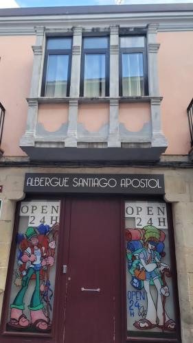 a building with a sign above a door at Albergue Santiago Apostol in Logroño