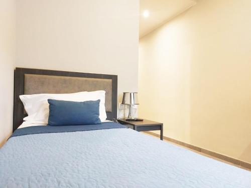 Кровать или кровати в номере Hotel Vitruvio