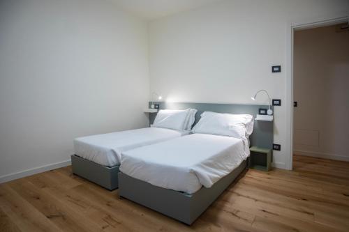 Un pat sau paturi într-o cameră la Casa Lina