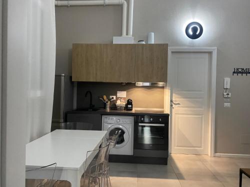 a kitchen with a stove and a dishwasher at Residenza Segrate Centro Novegro in Segrate
