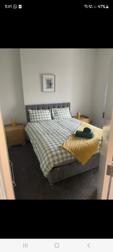 a bedroom with a large bed in a room at KKB accomodation in Moville