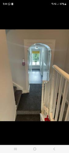 a view of a hallway with a stairway at KKB accomodation in Moville